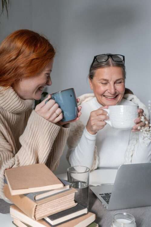 Mother and daughter enjoying coffee together.